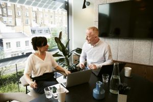 A man and woman discussing and sharing ideas.